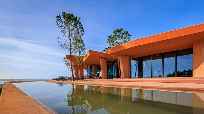 RCR arquitectes' palmares clubhouse in algarve suggests tectonic plates of red concrete