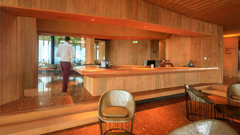 RCR arquitectes' palmares clubhouse in algarve suggests tectonic plates of red concrete