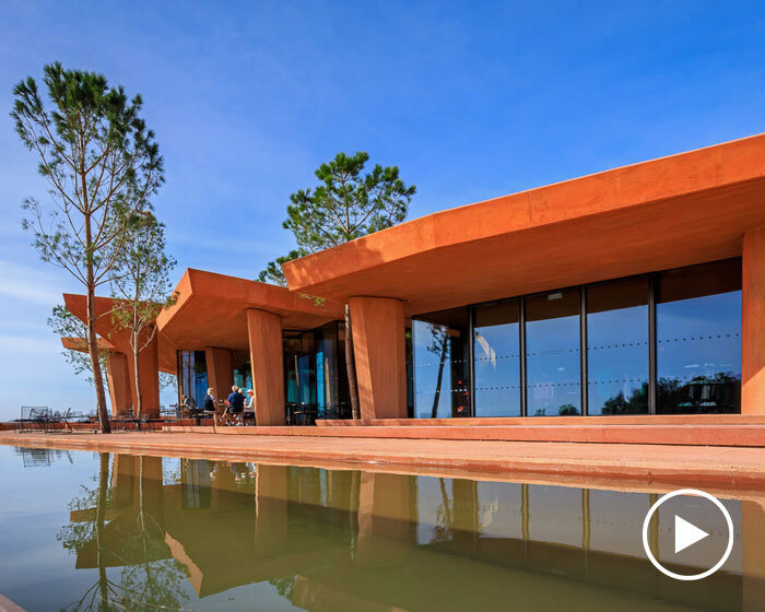 RCR arquitectes' palmares clubhouse in algarve suggests tectonic plates of red concrete