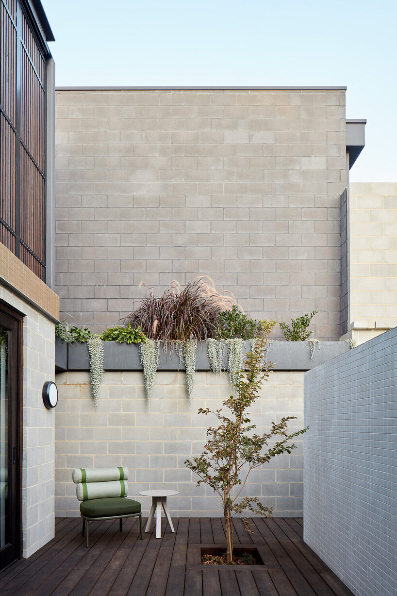 state of kin wraps 'shutter house' in timber batten skin in western australia