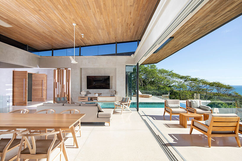 dubbed 'casa bell-lloc,' studio saxe's concrete dwelling is embedded into costa rican slope