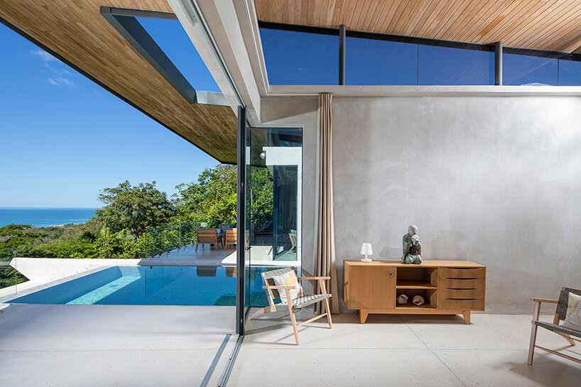 dubbed 'casa bell-lloc,' studio saxe's concrete dwelling is embedded into costa rican slope