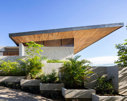dubbed 'casa bell-lloc,' studio saxe's concrete dwelling is embedded into costa rican slope