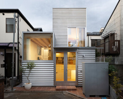 UNEMORI ARCHITECTS wraps the clustered volumes of its tiny 'house tokyo' in corrugated metal