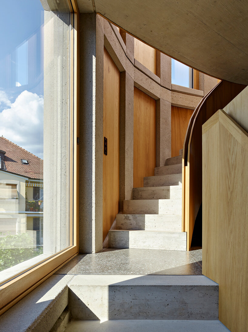 curved residential building by LOCALARCHITECTURE favors views of lake geneva in switzerland