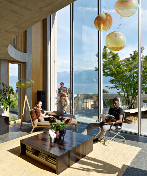 curved residential building by LOCALARCHITECTURE favors views of lake geneva, switzerland