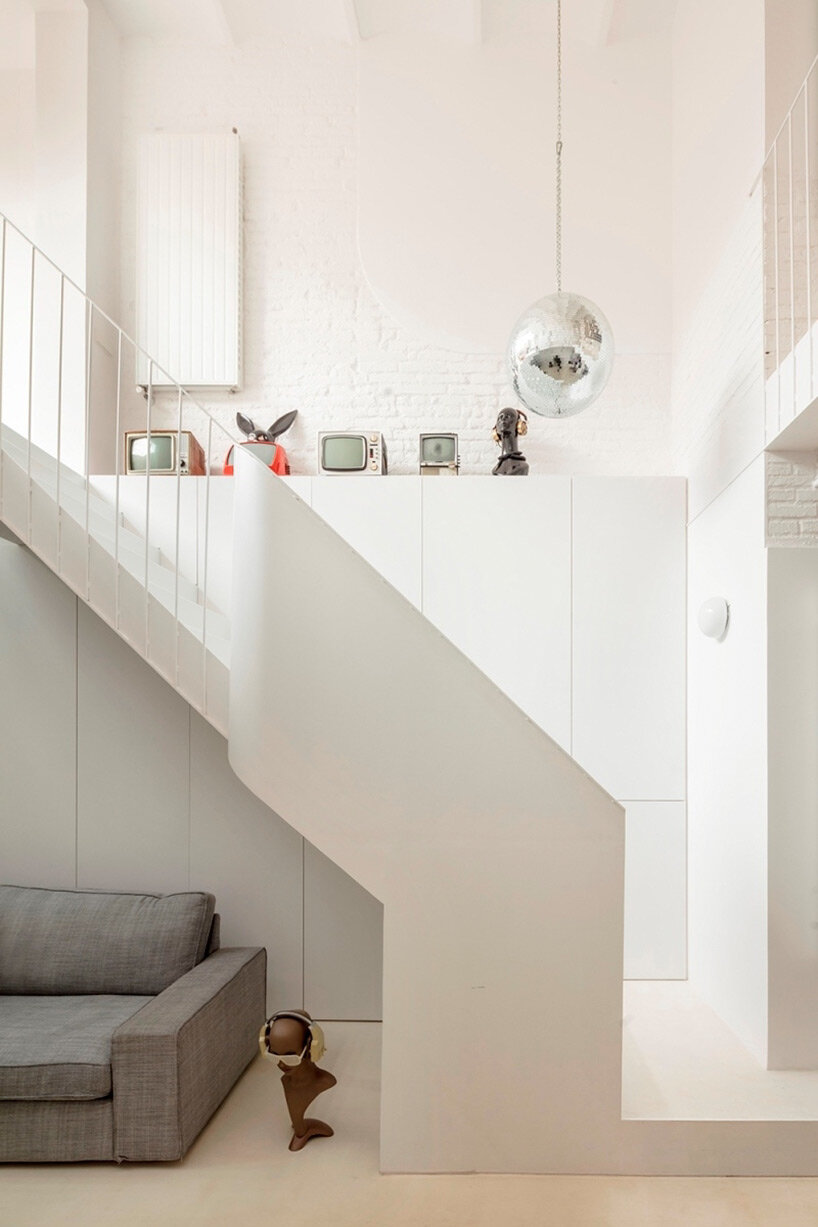 wooden boxes form the interior of this renovated mezzanine apartment by ...