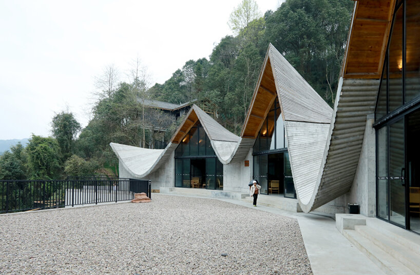 202 village guesthouses emerge from forested hunan as a group of mountainous peaks