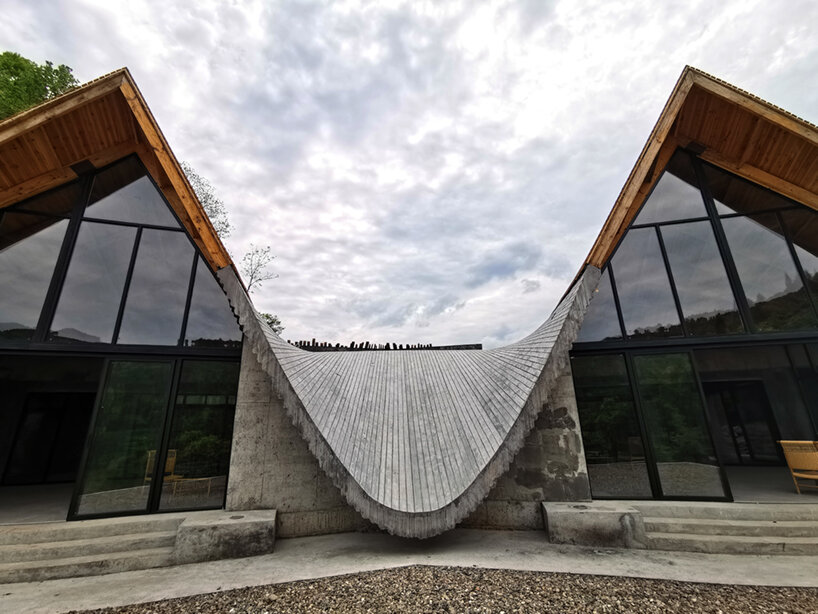 202 village guesthouses emerge from forested hunan as a group of mountainous peaks