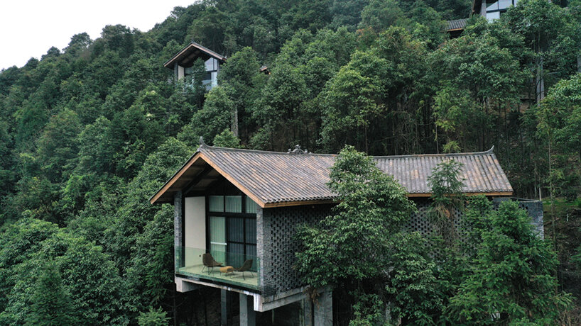 202 village guesthouses emerge from forested hunan as a group of mountainous peaks