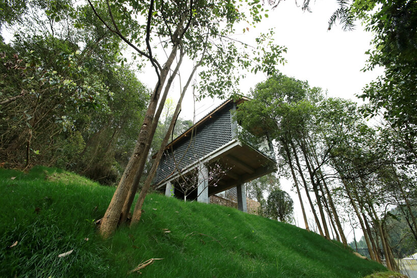 202 village guesthouses emerge from forested hunan as a group of mountainous peaks