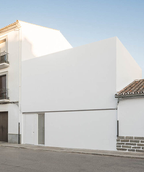 blank façade conceals minimalist all-white interior of 'chip & chop' house in spain