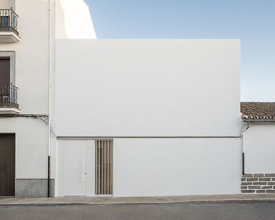 blank façade conceals minimalist all-white interior of 'chip & chop' house in spain