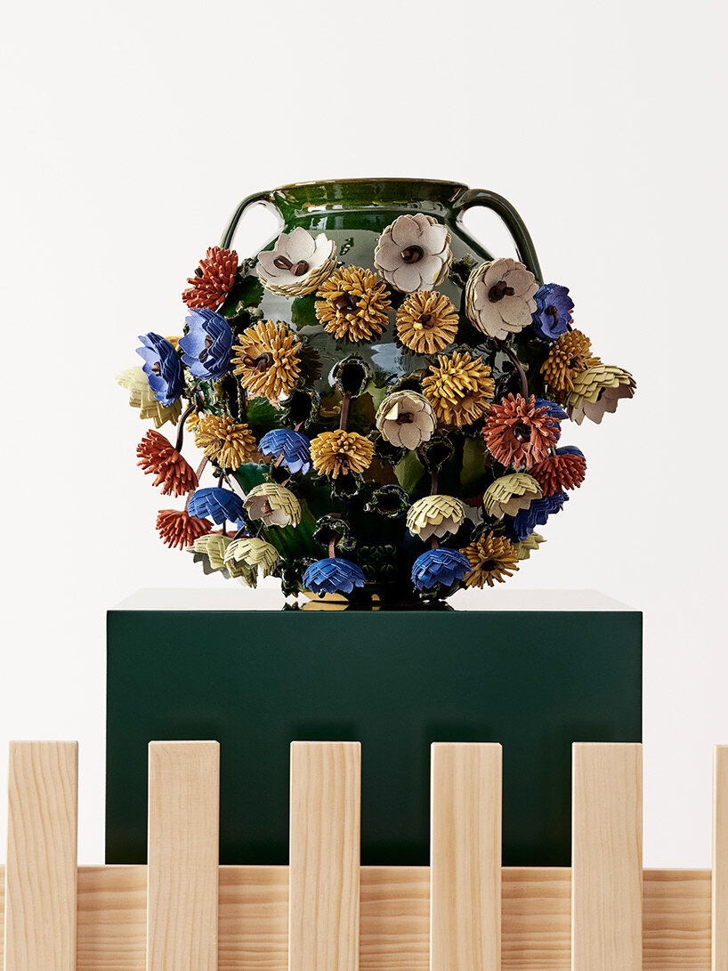eyes, tongues, flowers + knots emerge from punctured pots in