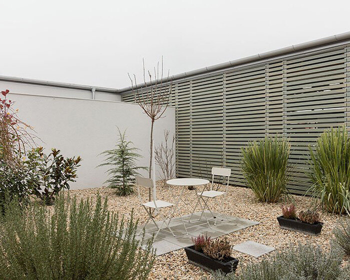 adam balog blends modern semi-detached house within hungarian vernacular architecture