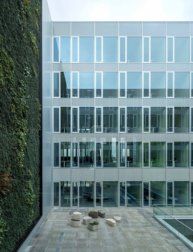 circular staircase spirals within the largest courthouse in the netherlands by KAAN