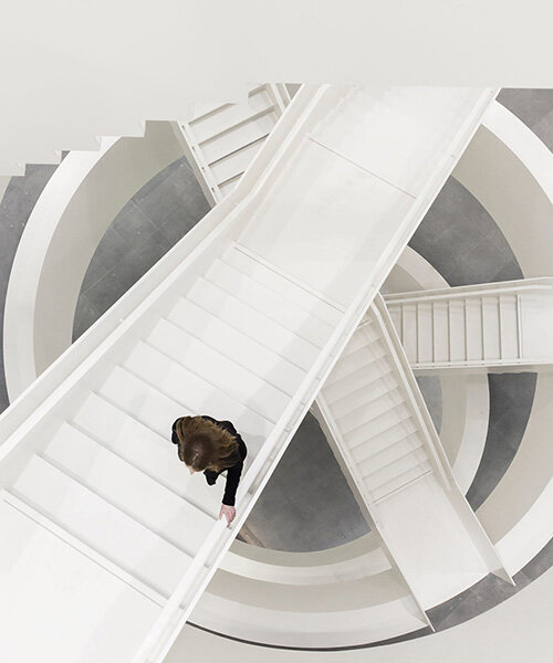 circular staircase spirals within the largest courthouse in the netherlands by KAAN