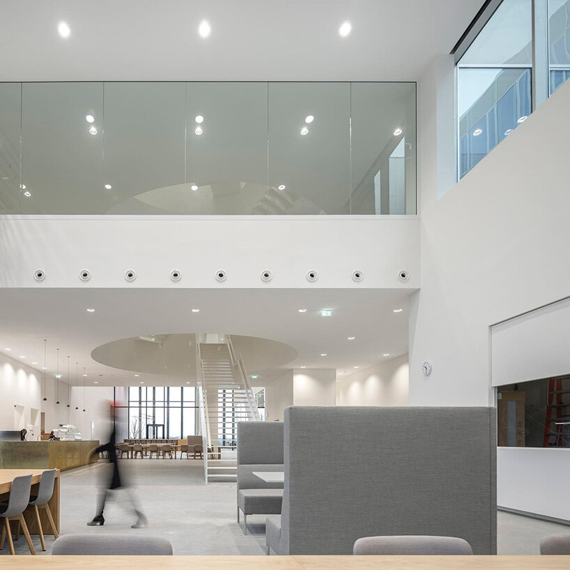 circular staircase spirals within the largest courthouse in the netherlands by KAAN