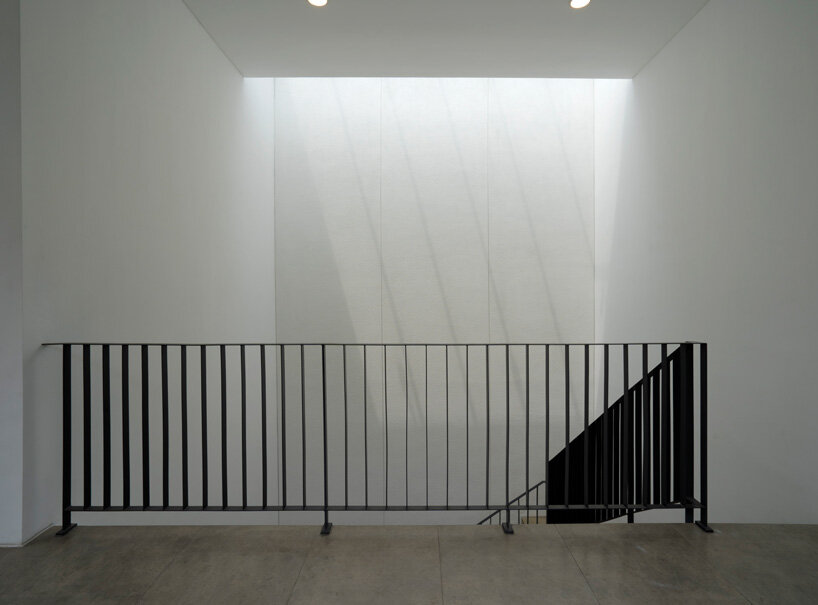 brick-clad façade of 'griyoase' house hides tree-planted courtyard in indonesia