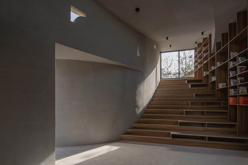 atelier xi's sculptural library emerges from ruins in old chinese village