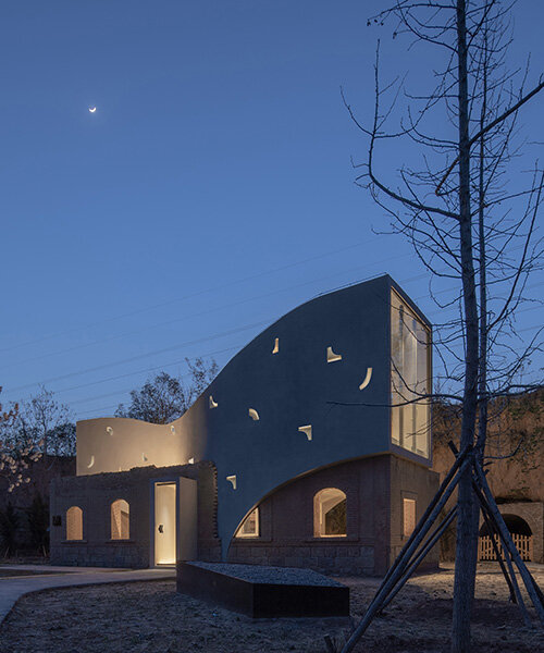 atelier xi's sculptural library emerges from ruins in old chinese village