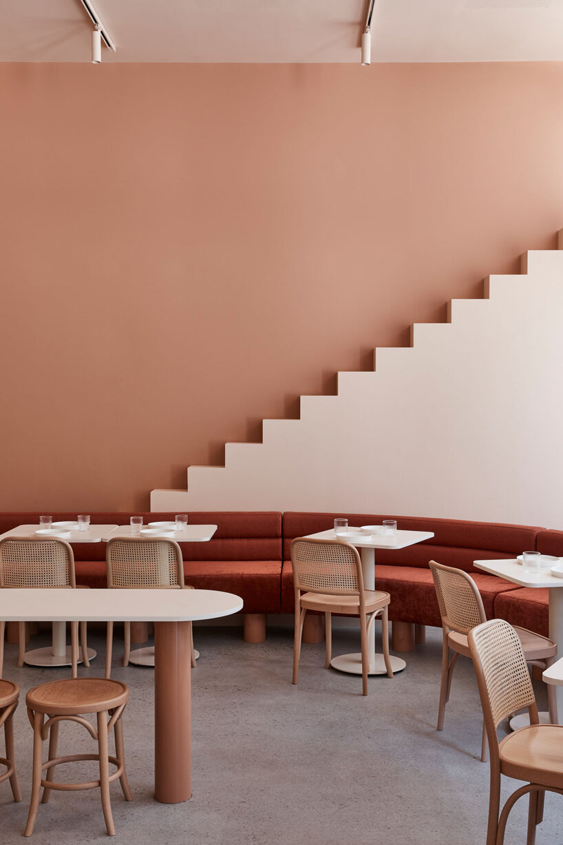 earthy hues take over this wes anderson inspired café in melbourne, australia