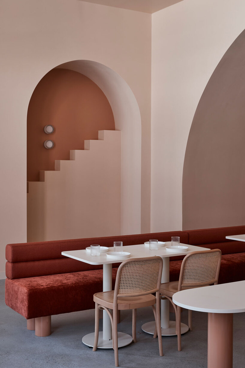 earthy hues take over this wes anderson inspired café in melbourne, australia