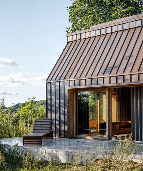 SLETH inserts copper-clad getaway cabin into danish forest