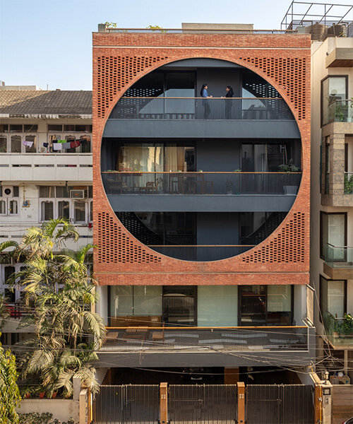 grand circular aperture within square brick screen dominates AKDA's family house in india