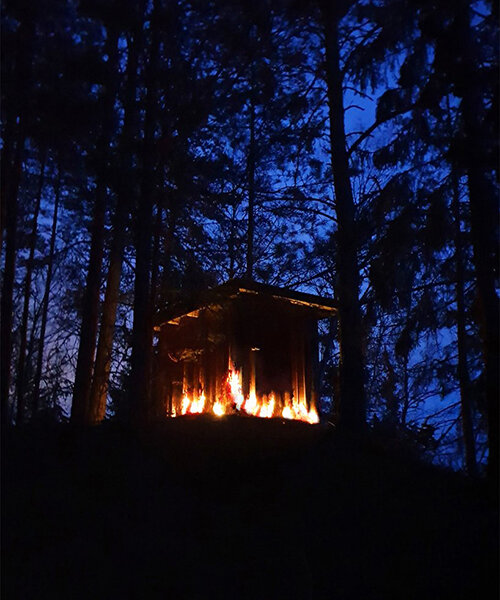 UMA installs a spectacular fire-like lighting system in a swedish forest