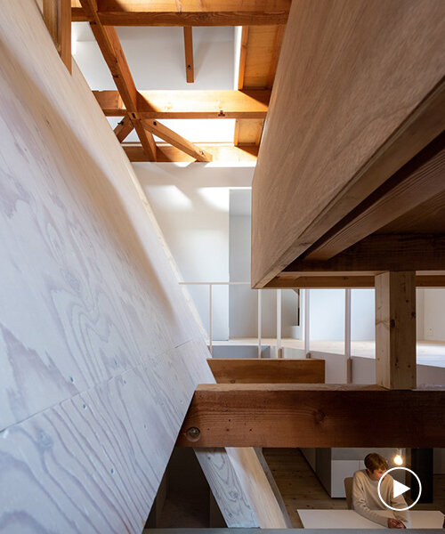 long diagonal wall carves up this renovated 40-year-old wooden house in shimogamo, japan