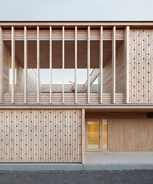 innauer matt's kindergarten engelbach is wrapped in a delicate timber facade