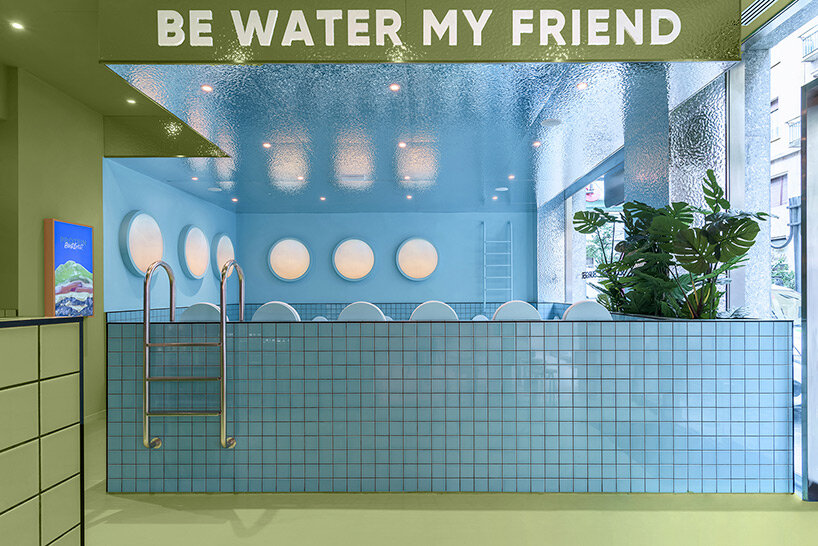 maskspacio forms a pool-like interior at a burger restaurant in turin, italy