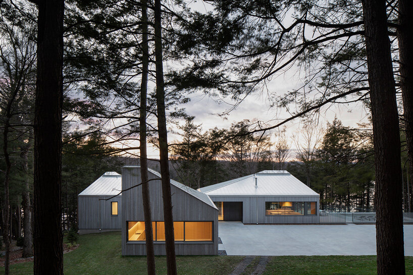 naturehumaine tops lake house in canada with sculptural slanted roofs + polygonal skylights