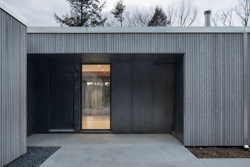 naturehumaine tops lake house in canada with sculptural slanted roofs + polygonal skylights