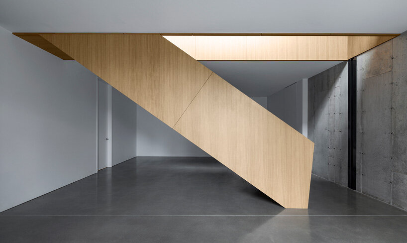 naturehumaine tops lake house in canada with sculptural slanted roofs + polygonal skylights