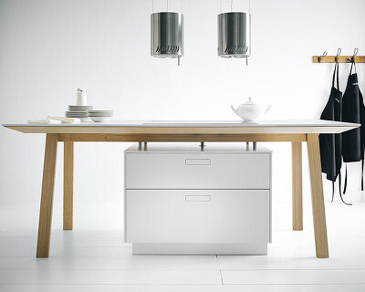 next125 hides functional drawers underneath archetypal kitchen table