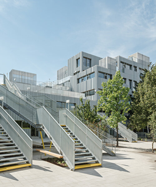 corrugated sheet clads a school extension in vienna by PPAG architects