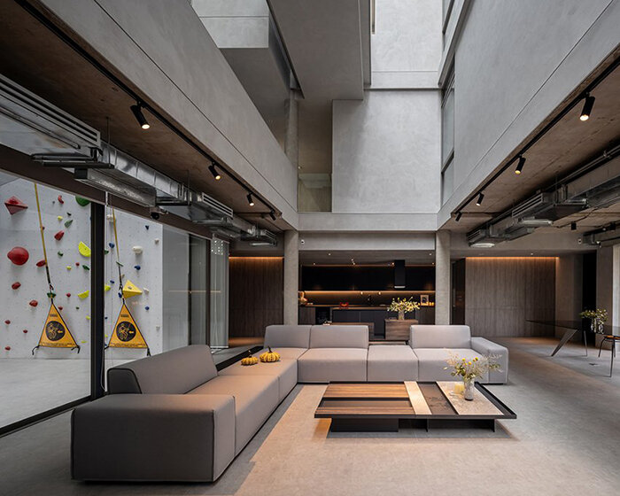 perforated brick facade + massive climbing wall adorn this house in thailand