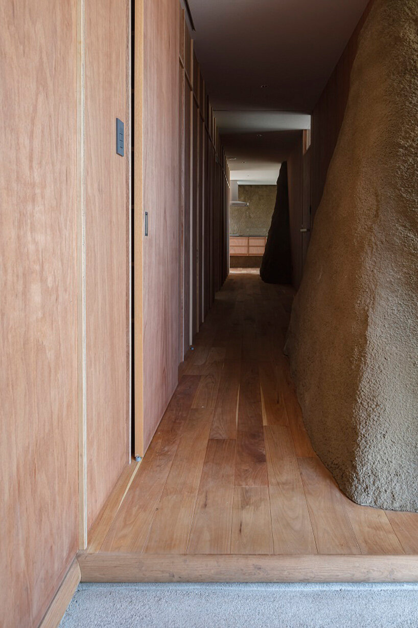 ADX transforms excavated soil into trapezoid walls for this house in japan