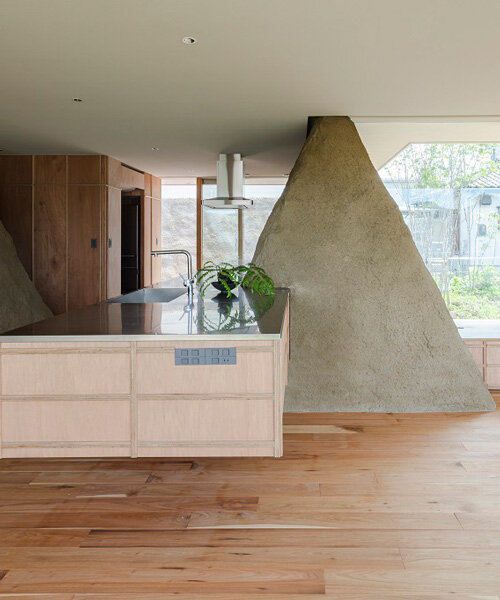 ADX transforms excavated soil into trapezoid walls for this house in japan