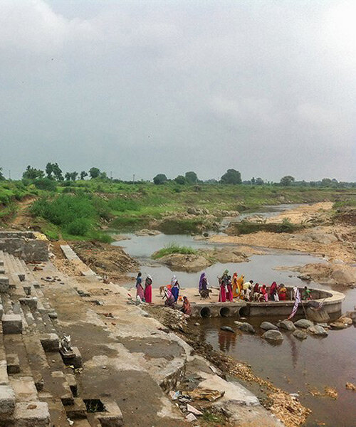 stone platform in temple reconstruction leads devotees towards the moran river in india