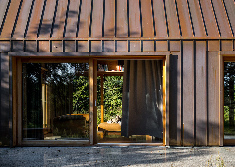 SLETH inserts copper-clad getaway cabin into danish forest