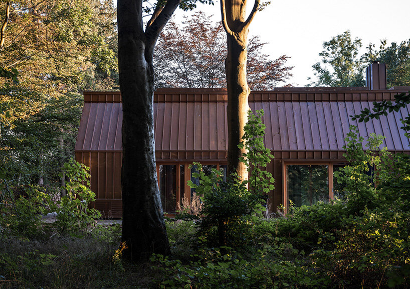 SLETH inserts copper-clad getaway cabin into danish forest