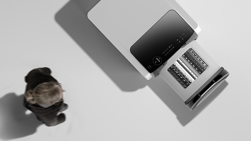 the visdom machine machine by kim kyeong-su features a sliding drum that opens on top