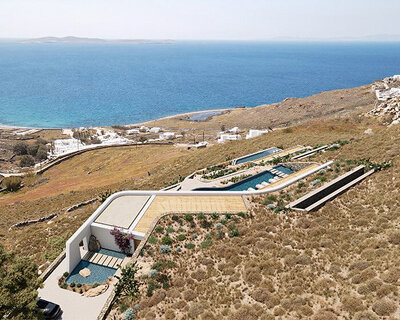 white rock villa by chorografoi architects embraces the natural landscape of mykonos, greece