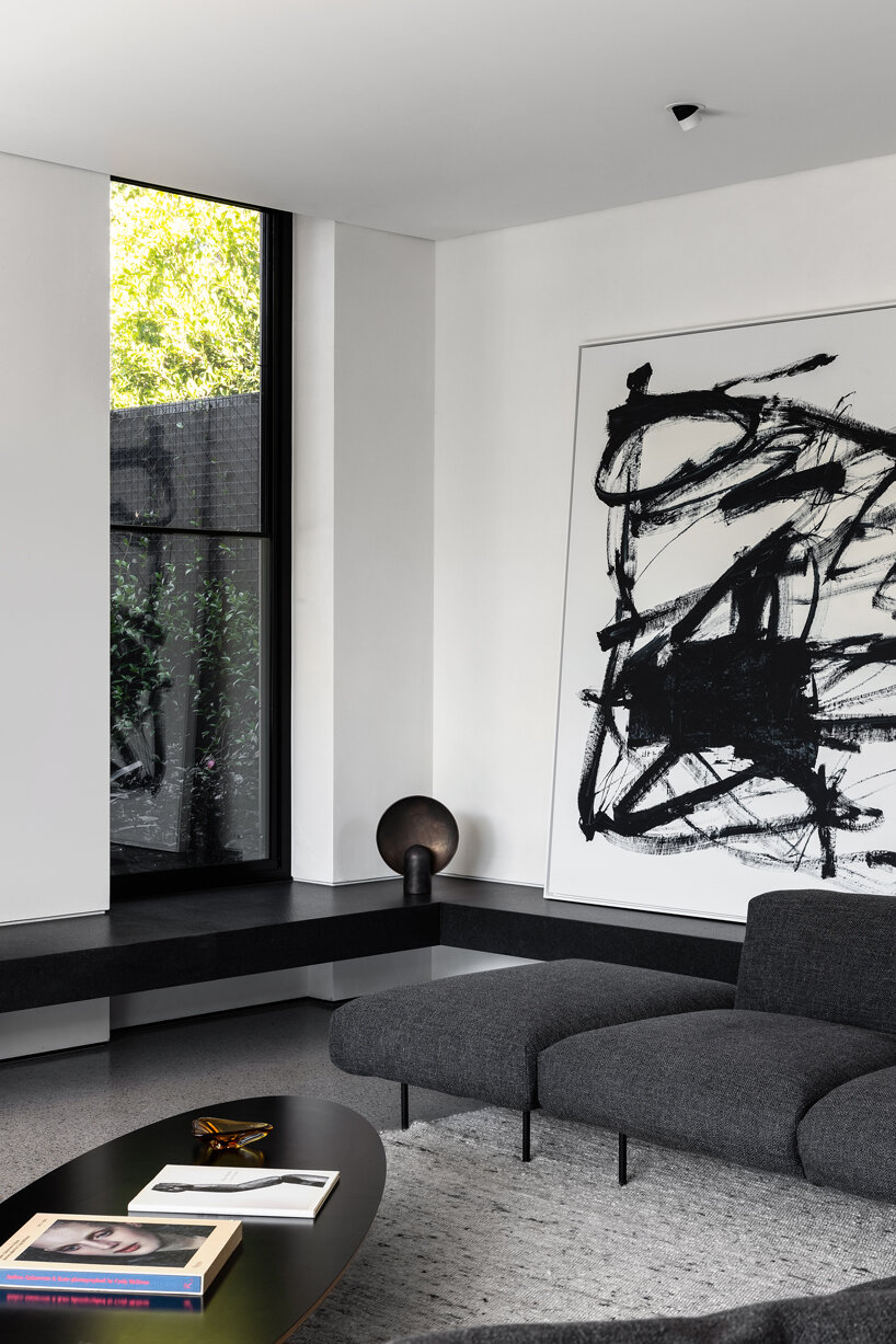 strong symmetrical lines + raw materials dominate concrete residence by the coast of australia