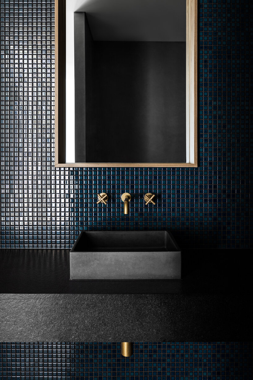 strong symmetrical lines + raw materials dominate concrete residence by the coast of australia