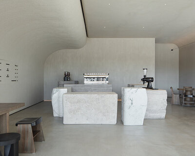 VSHD designs coffee shop in dubai with blocks of monolithic stone