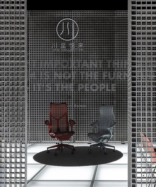 gridded panels + illuminated tiles make up this booth for herman miller’s collection